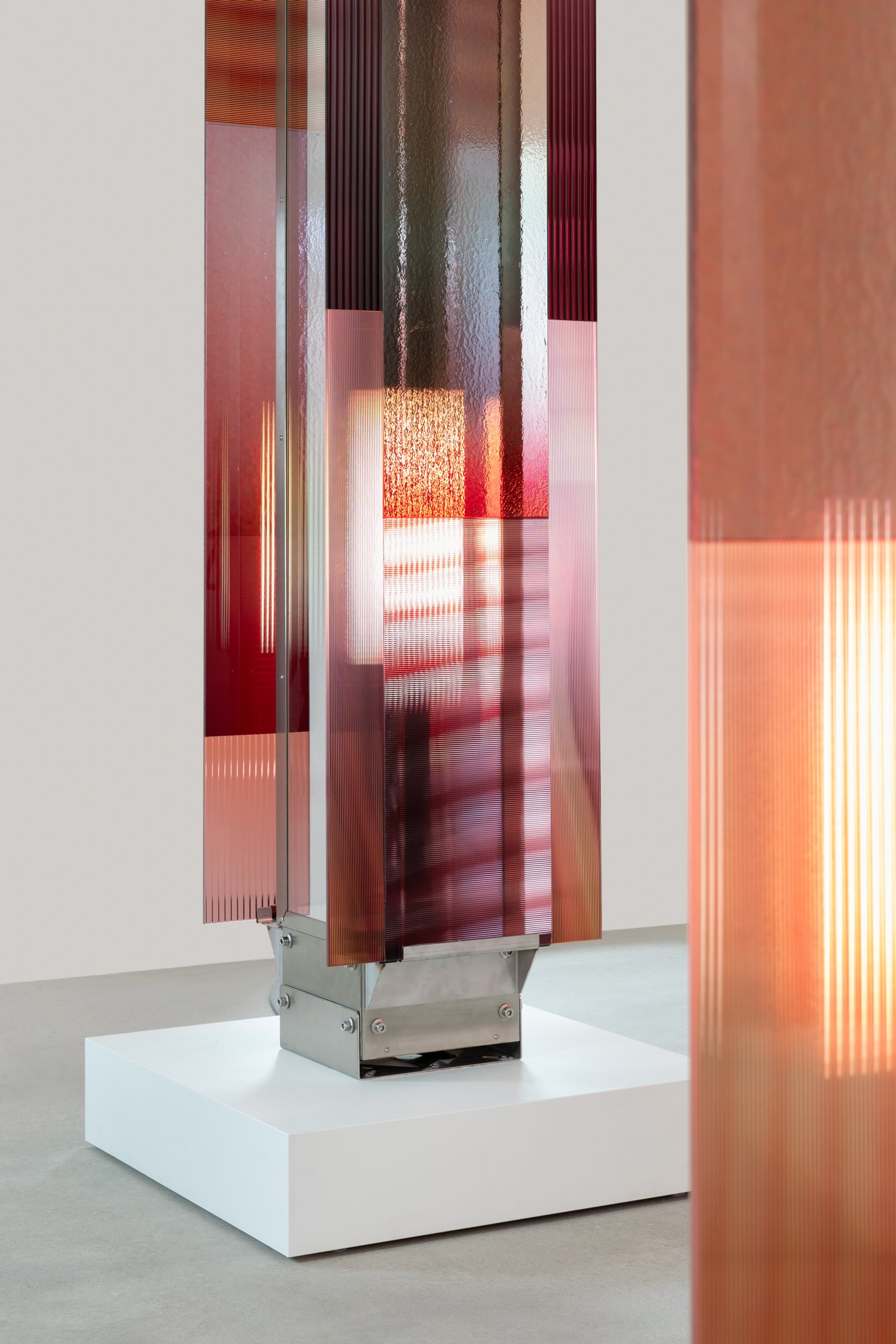 Moving light behind amber and rose glass in Garden of Hope at BOON_MONCEAU