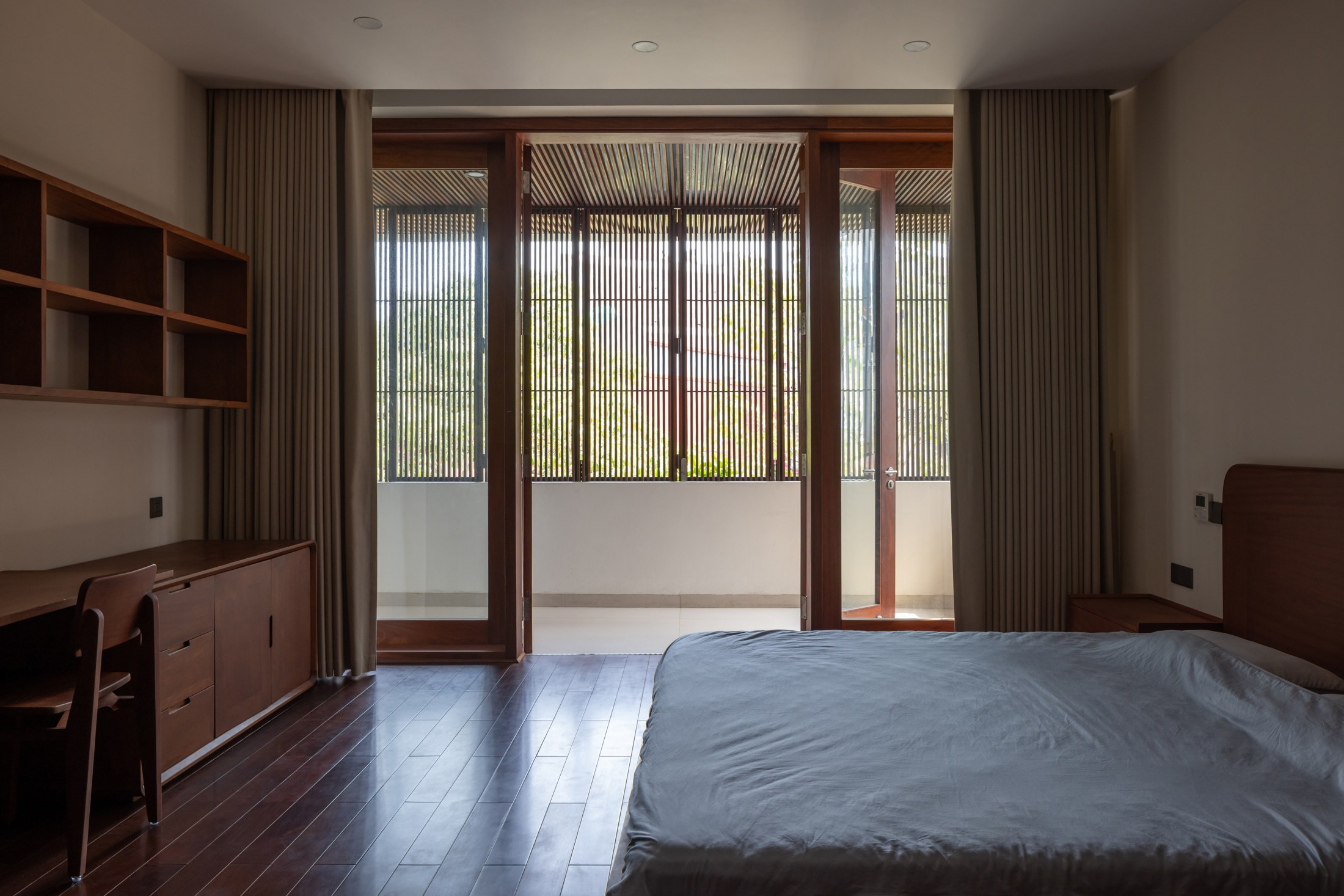 Interior and timber detailing at Hong Tien Garden Villa by COTAM Studio