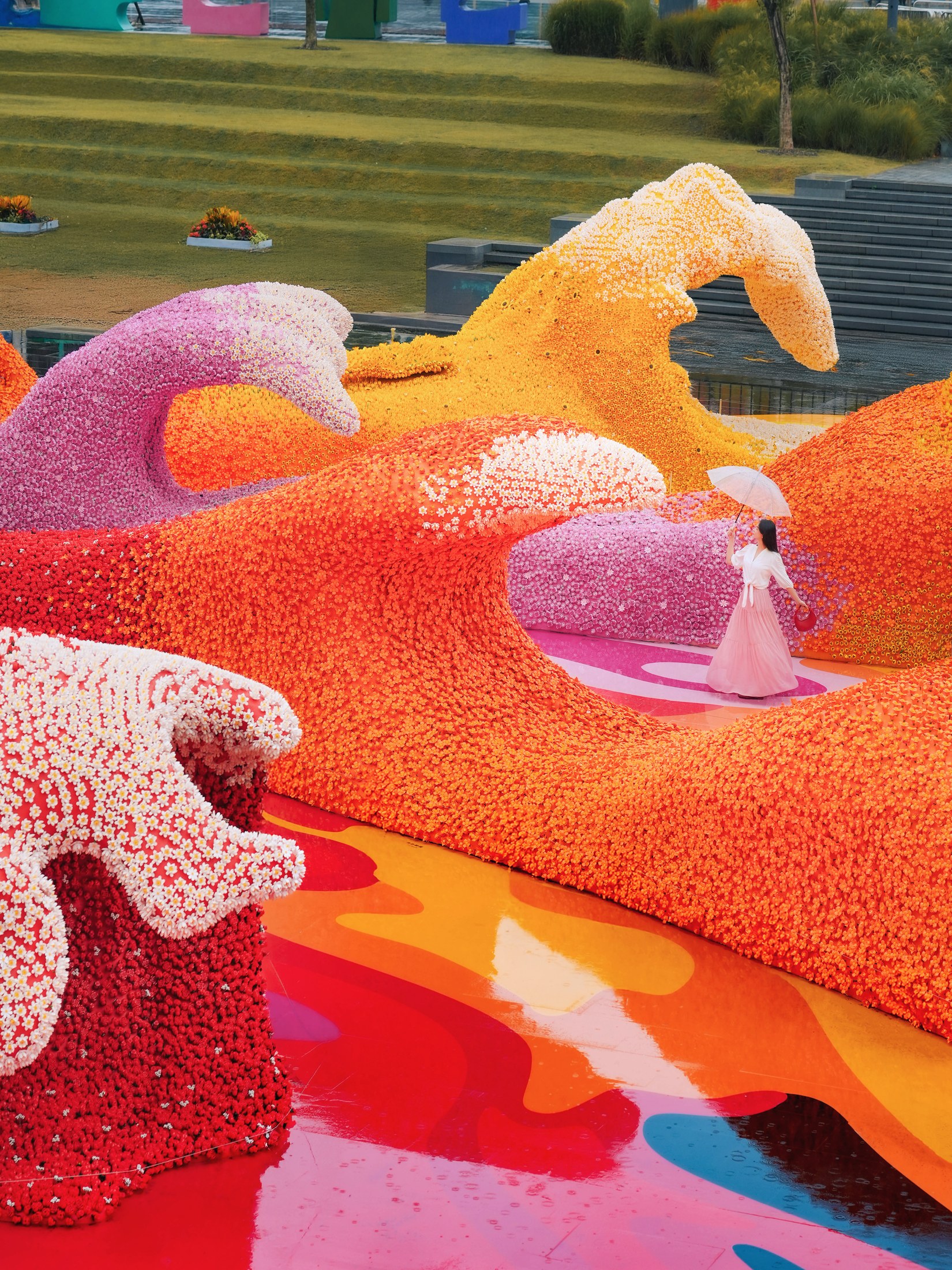Curled forms assembled from colourful LEGO botanical elements