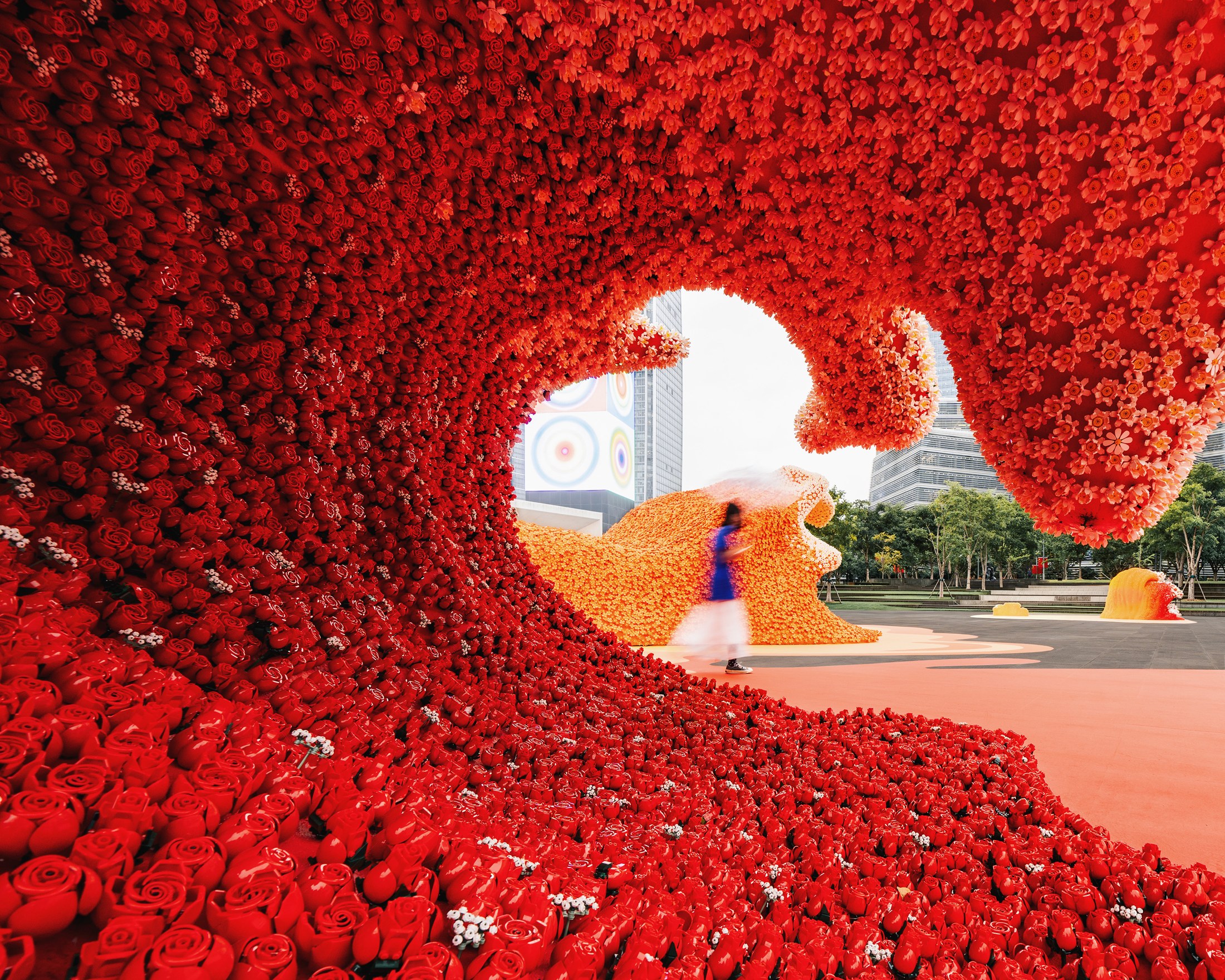 View through a red flower-covered opening in the Botanical Wave