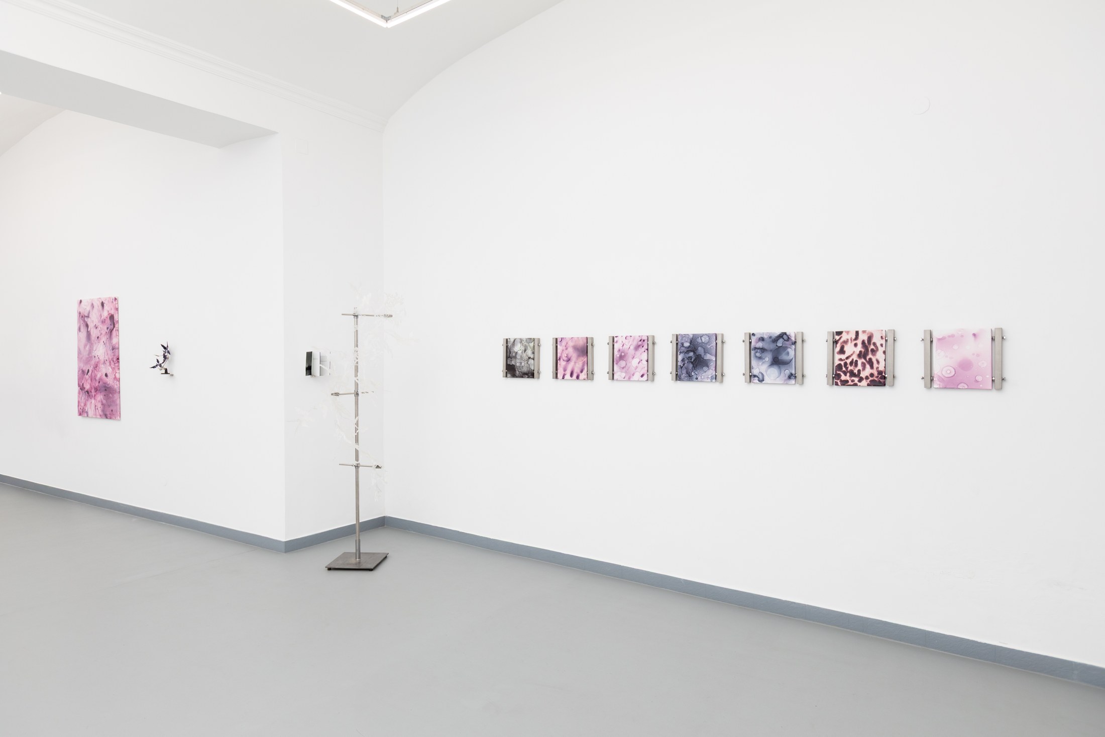 Pink paintings and a freestanding sculptural form