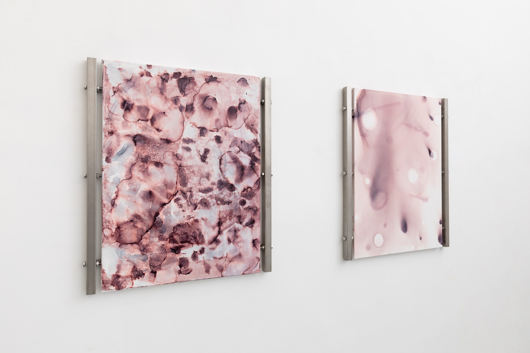 Close-up of two pink organic paintings