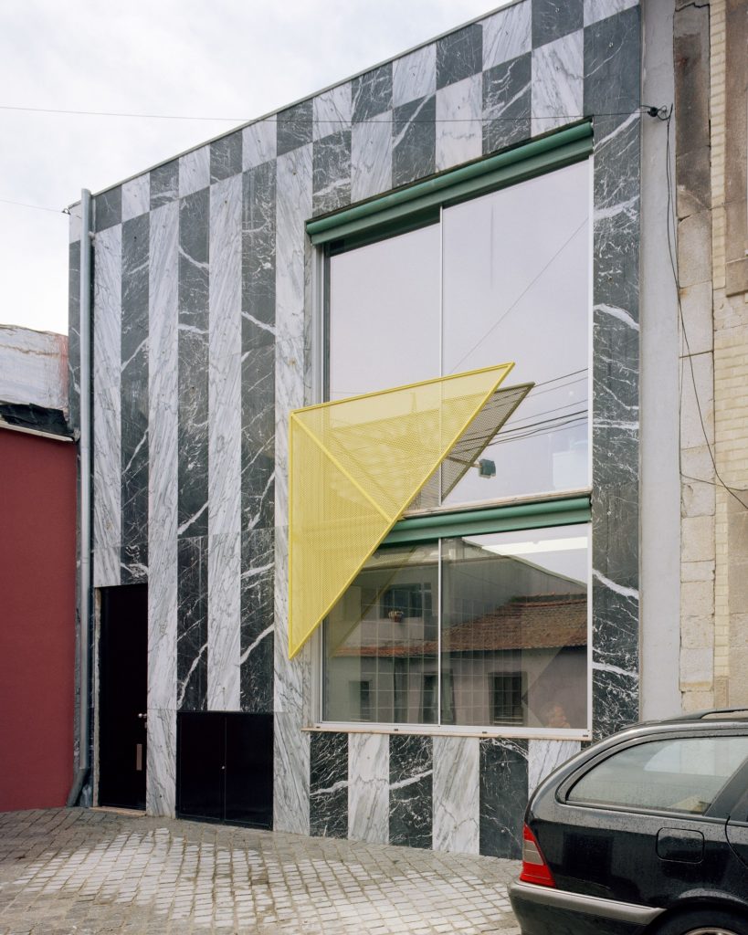 street facade at House around a column by fala