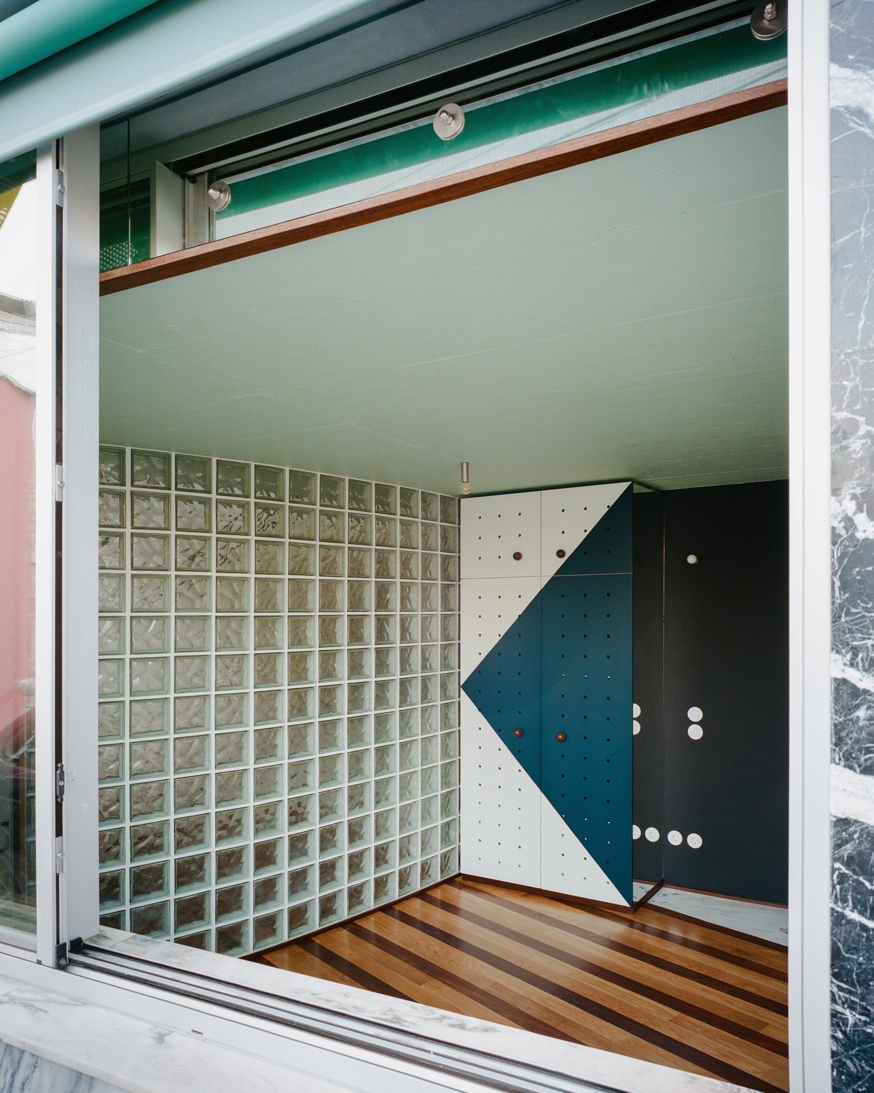 bedroom facing the street at House around a column by fala