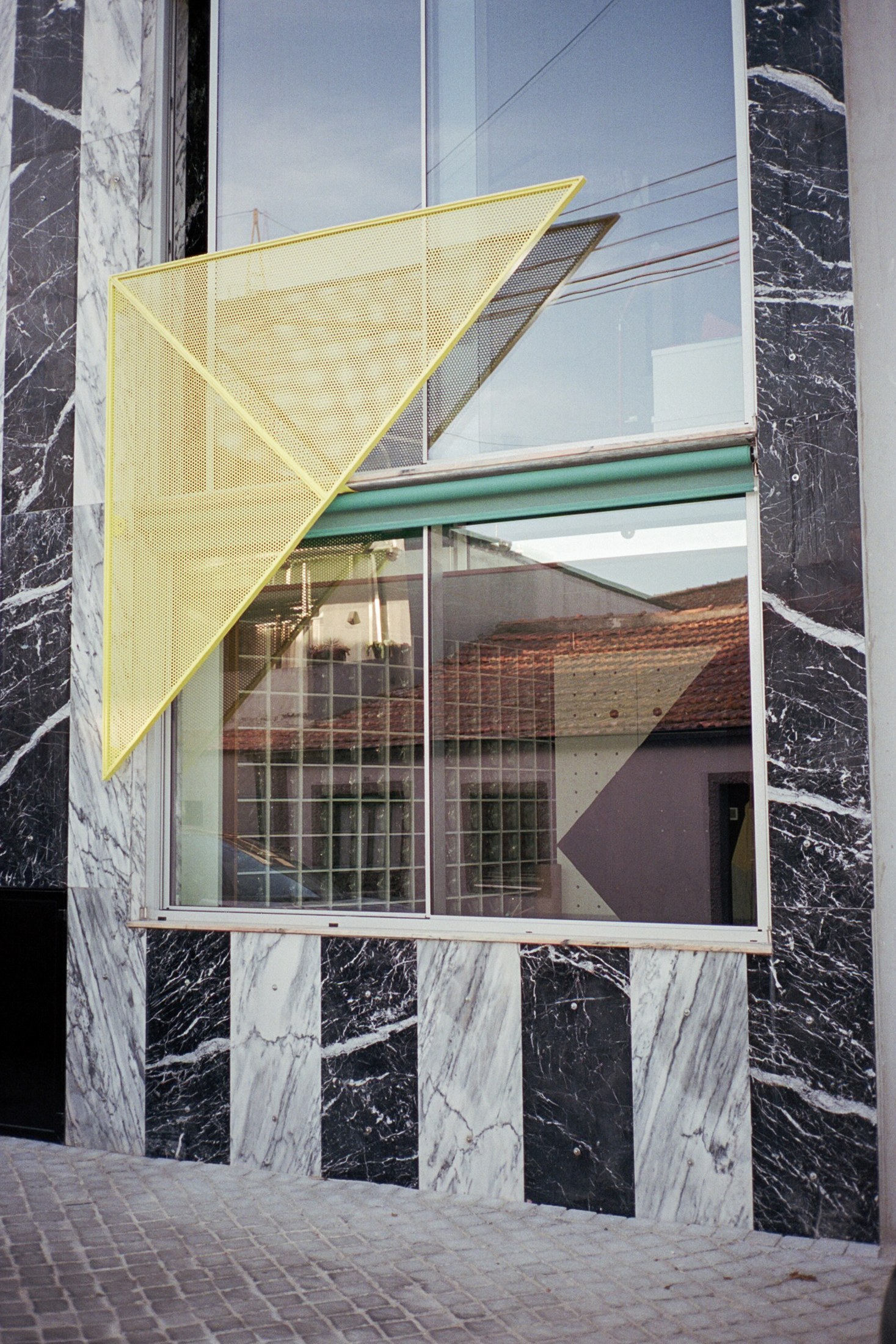 facade detail at House around a column by fala