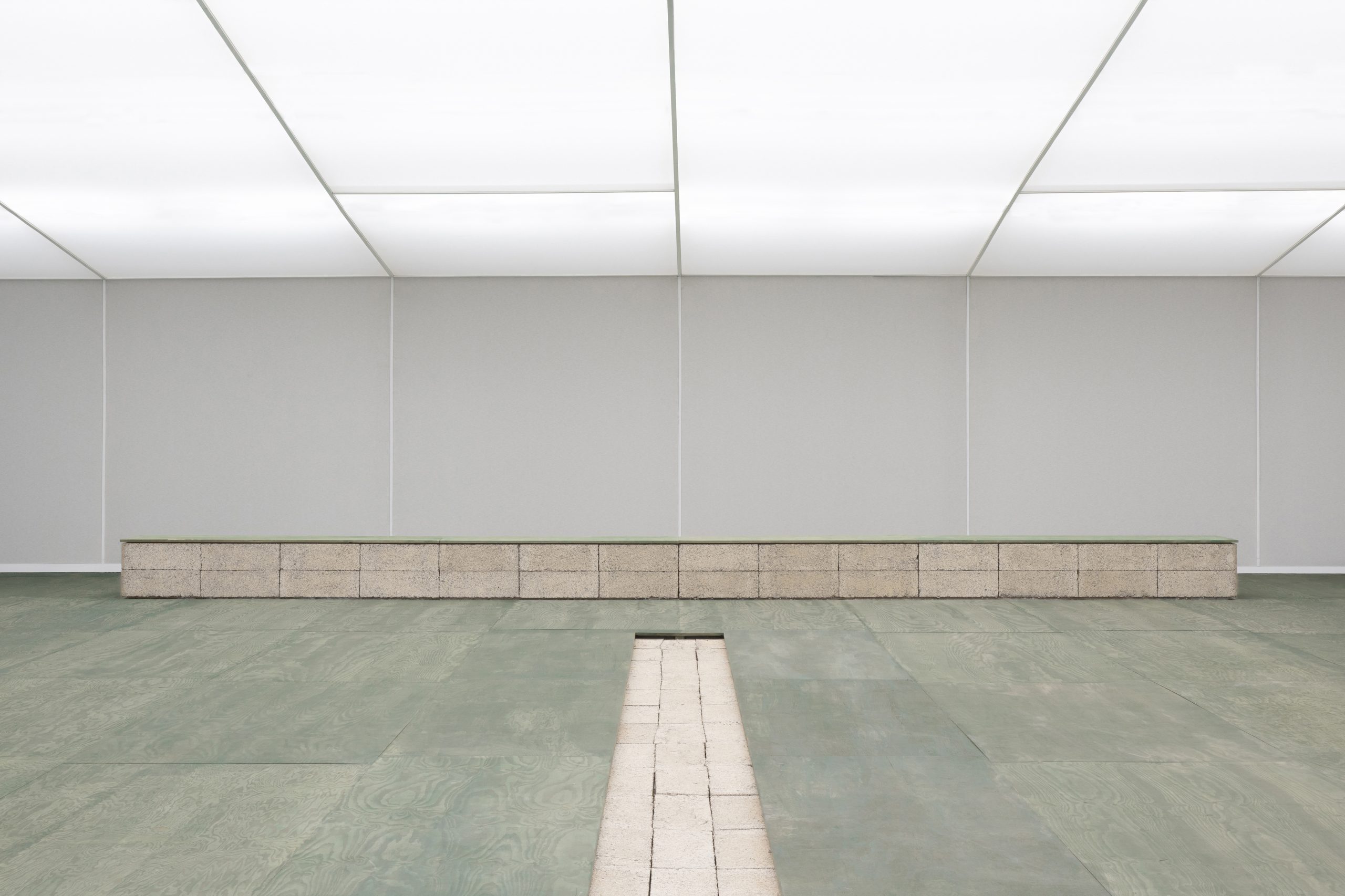 Green floor and low modular seating in the MATTER and SHAPE auditorium