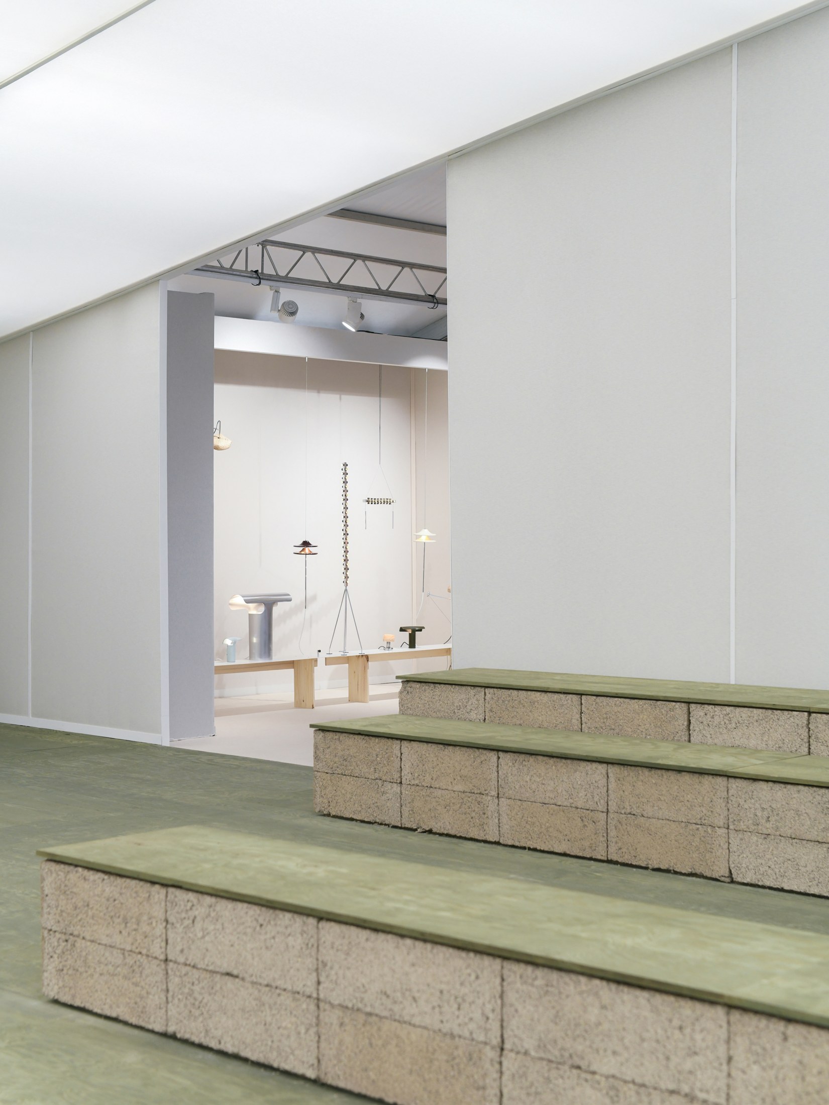 Tiered green seating in the auditorium designed by JA Projects