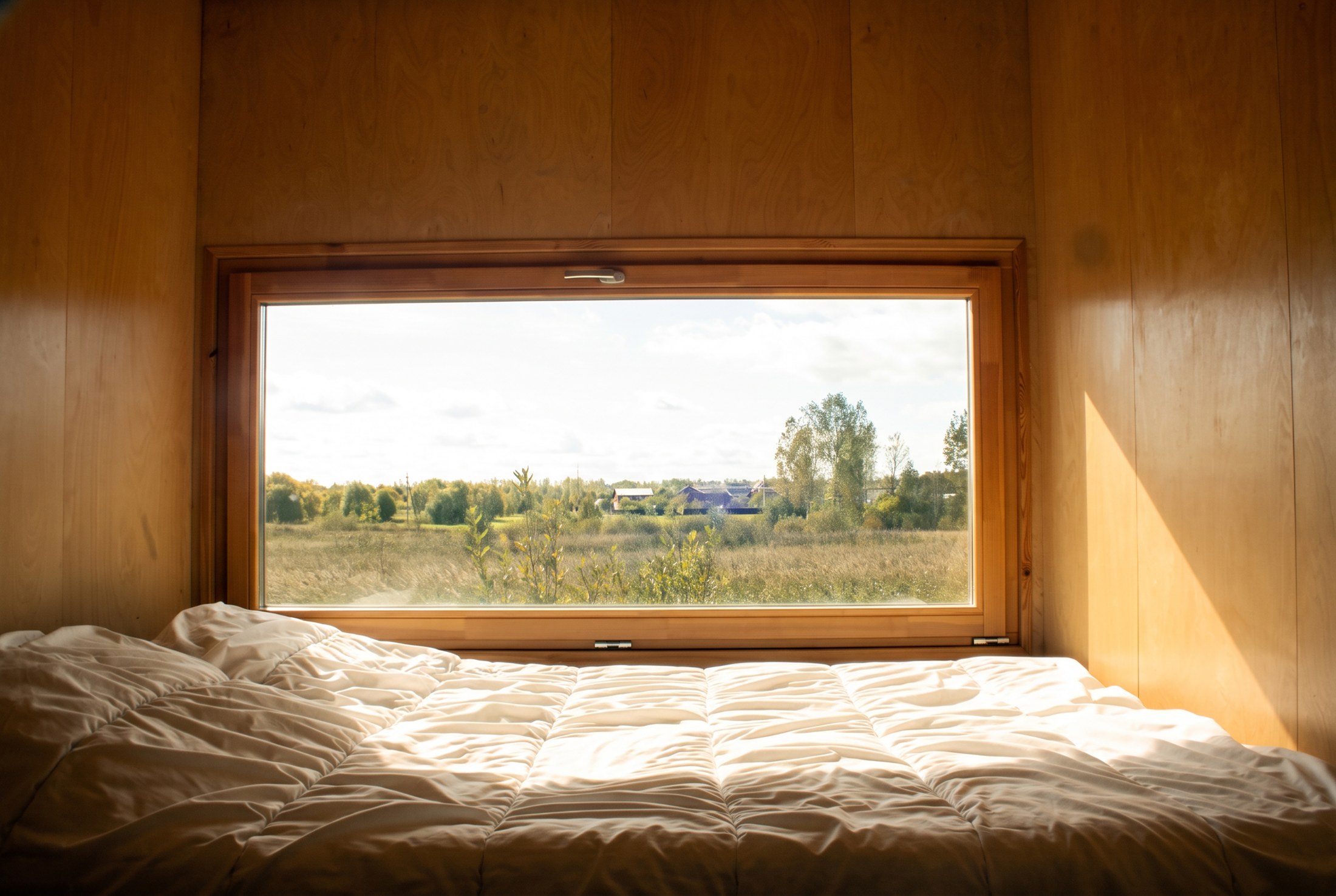 Bedroom with a low horizontal landscape window