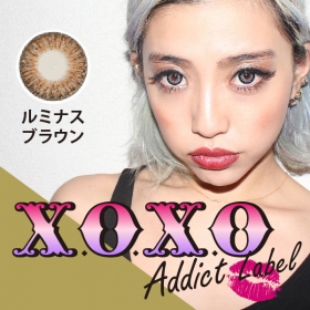 「X.O.X.O アディクトレーベル ルミナスブラウン カラコン1年（GIRLS PARTY（ガールズパーティ））」の商品画像の1枚目