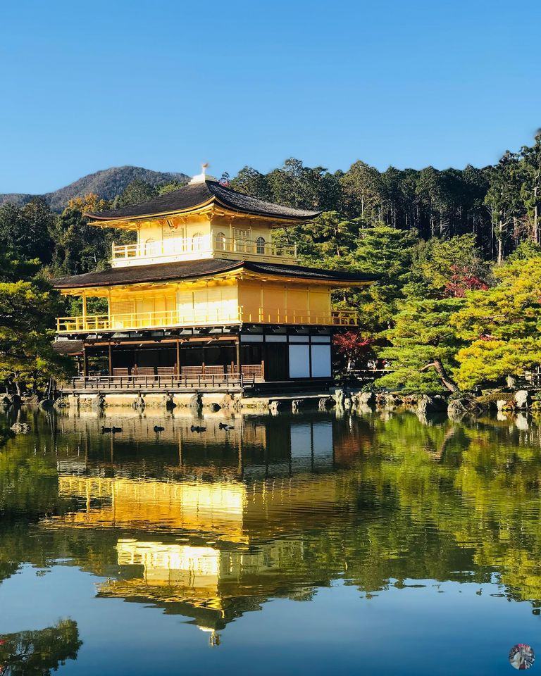The temple casting its reflection onto the peaceful pond