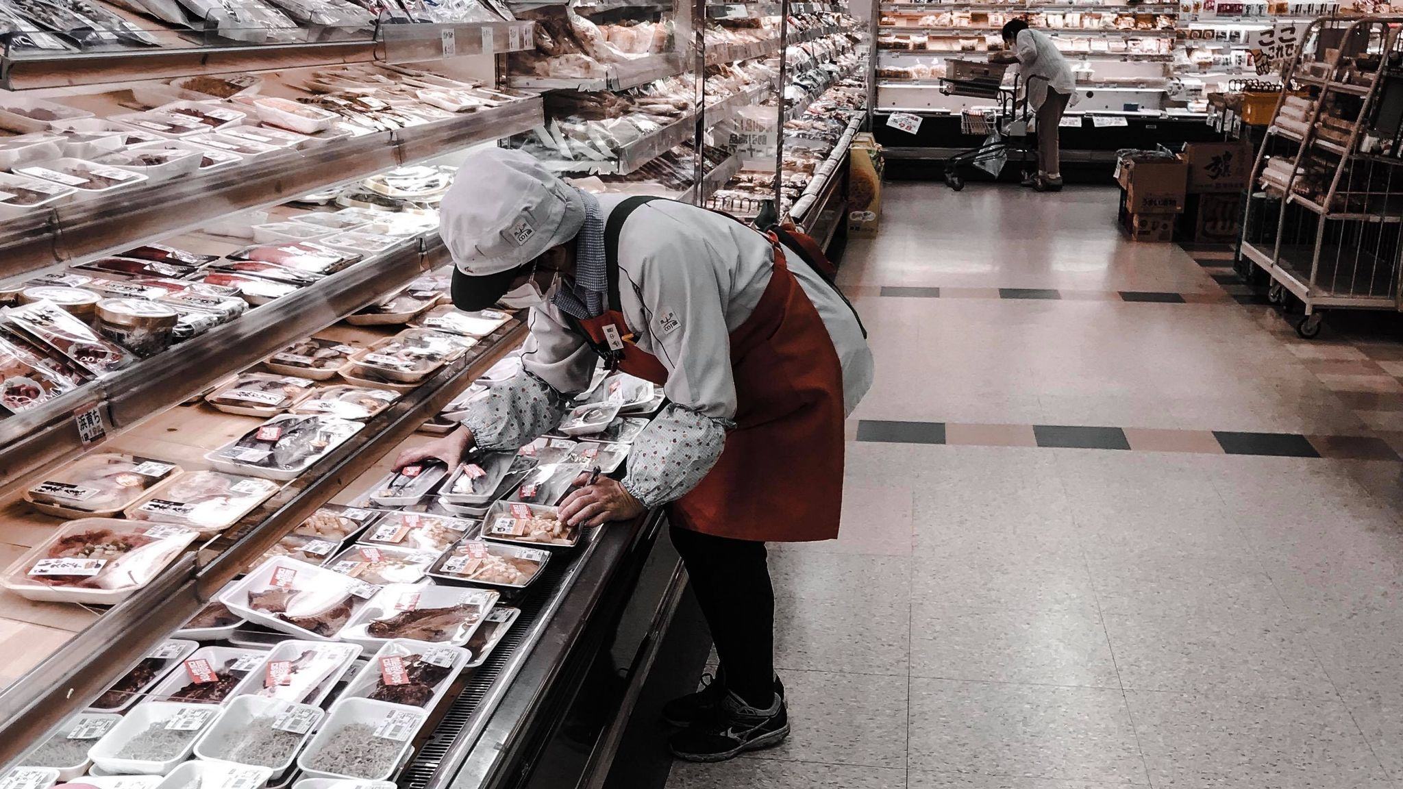 Old people working in the supermarket