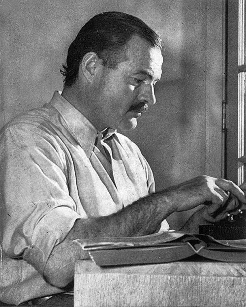 Hemingway at his typewriter - Public Dmain