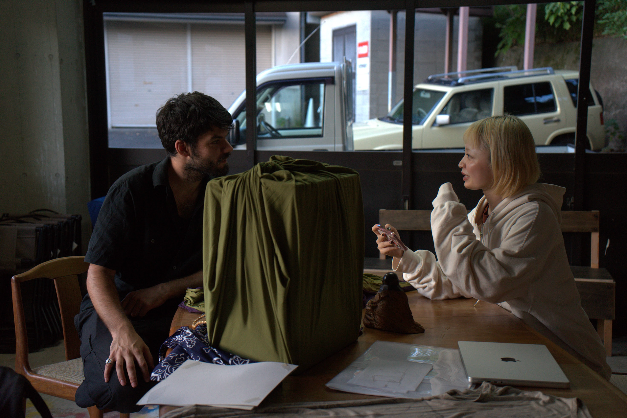 Yuxin interviewing Jules at STUDIO MONAKA, with the bag Jules carried while exchanging objects with people around the city.